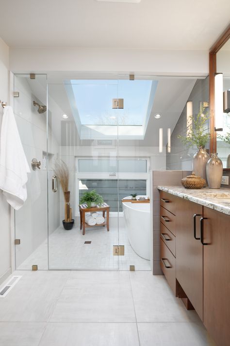 This wet room design features Cherry flat-panel cabinets with black hardware, granite countertops, gray tile, and champagne bronze fixtures. Wet Zone Bathroom Master Bath, Transom Window Shower Master Bath, Big Glass Shower Master Bath, Angled Ceiling Bathroom, Wet Room Japanese Tub, 36 Breathtaking Walk-in Shower Ideas, Angled Ceiling, Bronze Fixtures, Bathroom Retreat