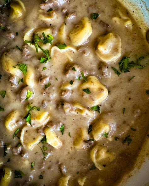 It doesn’t get more “comfort-foody” than this folks. Think of this like a combo of Beef Stroganoff and Cream of Mushroom Soup, but with Cheese Tortellini. Yeah, it’s wild, but in a good way. This dish checks all the boxes: creamy, cheesy, and meaty, all wrapped up in pasta. It's probably one of the easiest ways to reach food coma status with little effort. The flavor is ridiculously satisfying. Recipe With Golden Mushroom Soup, Creamy Beef Tortellini Soup, Beef Stroganoff Tortellini, Cheesy Beef Tortellini, Mushroom Tortellini Soup, Beef Tortellini, Cream Of Mushroom Pasta, Mushroom Tortellini, Beef Stew Meat Recipes