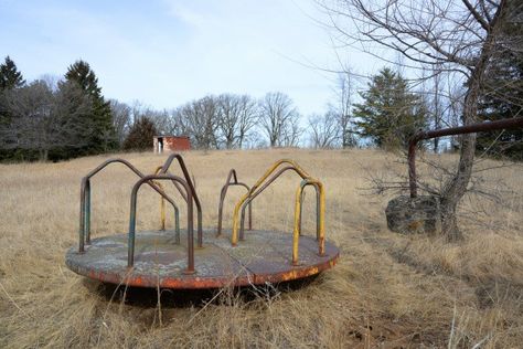 The kid's merry-go-round & teeter-totter still sit, in front of where the big screen once was at the Wadena Drive-In Theater in Minnesota. (Pic 3 of 4). Merry Go Round Playground, Abandoned Playground, Teeter Totter, Drive In Theater, Merry Go Round, Military Base, Drive In, Big Screen, Garden Bridge