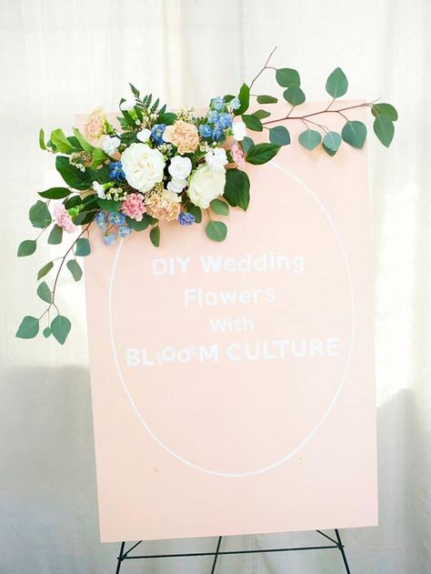 Add a floral accent to your wedding signage to tie together your wedding details. Learn how to assemble signage florals in this tutorial from Bloom Culture Flowers.  The post DIY Floral Accent for Wedding Signage appeared first on The Budget Savvy Bride - helping couples plan beautiful weddings on a budget they can actually afford!!. Floral Wedding Signage, Diy Signage, Diy Wedding Signs, Wedding Decor Floral, Unique Wedding Signs, Floral Wedding Sign, Diy Your Wedding, Fake Flower Arrangements, Wedding Signs Diy