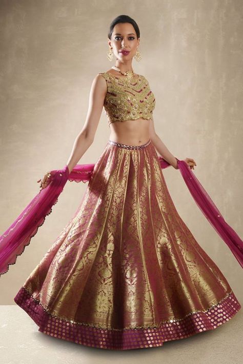 This Set Features A Pomegranate Benarasi Lehenga Set. A Kalidar Benarasi Lehenga Embellished With Mirror Belt And Border Is Teamed With The Classic Renee Label Mirror Work Blouse. The Sheer Net Blouse Is Embellished With Dori, Mirrors, & Beads With Sequin Sheathed Bustier. A Net Dupatta With Mirror Buttis & Scallop Border Completes The Look. Cancan & Pockets Are Included. Mirror Belt, Brocade Lehenga, Net Blouse, Net Skirt, Mirror Work Blouse, Scallop Border, Organza Lehenga, Net Blouses, Embellished Belt