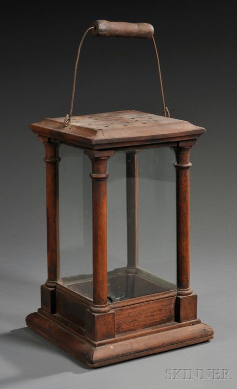 Turned and Molded Cherry Candle Lantern, America, early 19th century, square lantern topped with wire bail and turned hardwood handle, with glazed panels and columnar corners, the base removable for cleaning and candle replacement, (minor imperfections), ht. to top of upright handle 20, lg. of sides 8 3/4 in. Cherry Candle, Square Lantern, Candle Holder Ideas, Rustic Wood Lanterns, Wooden Lantern, Lantern Candle Holder, Primitive Lighting, Old Lanterns, Antique Lanterns