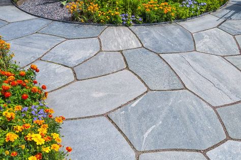 Laying an outdoor slate tile patio, walkway or other outdoor area isn't a complicated job. Slate tiles are made from natural material and add an earthy look to a patio. Using a concrete base, outdoor slate tiles can be arranged in a beautiful pattern, creating a patio that will last for years. Slate Patio, Cake Slicer, How To Build Steps, Bluestone Patio, Flagstone Patio, Patio Tiles, Floor Tile Design, Patio Flooring, Low Maintenance Landscaping