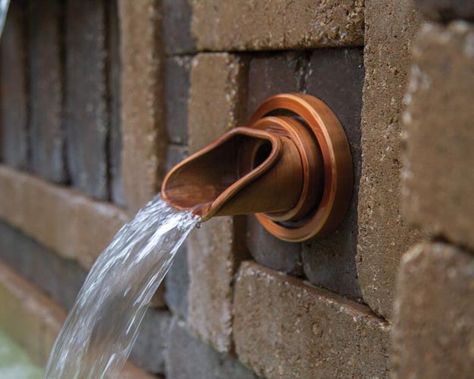 Wall Spouts are an easy and elegant way to add the sight and sound of water to vertical surfaces Wall Spouts are great for smaller outdoor areas or a perfect complement to larger spillways Solid brass fixtures add a captivating focal point to both traditional and contemporary walls and patios Choose from four architectural designs with oil rubbed bronze or antique copper finish to fit any style Integrated drip edge to eliminate backflow down the wall Includes grounding lug for bonded systems For Water Feature Wall, Walkway Landscaping, Outdoor Water Features, Drip Edge, Pond Lights, Water Spout, Water Gardens, Brass Fixtures, Oval Plates