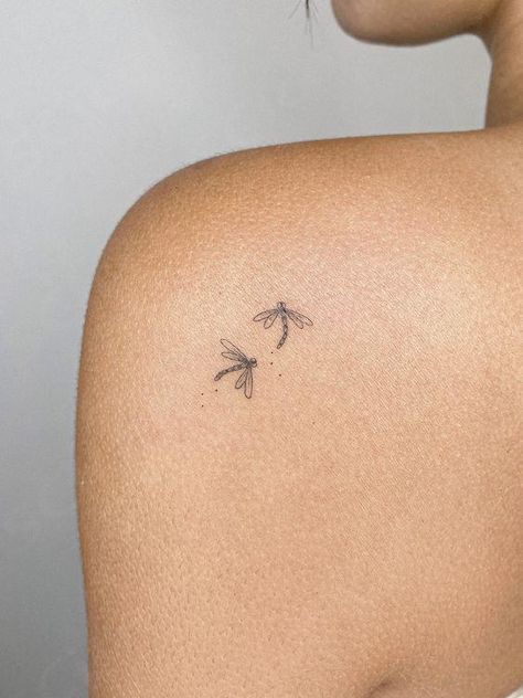 Fine line tattoo of two dragonflies. Los Angeles based tattoo artist. Perfect tattoo for women. Perfect tattoo for men. Perfect tattoo to match with a friend! #tattooartist #finelinetattoo Dragonflies Tattoo For Women, Two Dragon Fly Tattoo, Minimalist Tattoo Animals, Travel Tattoo Aesthetic, Dainty Bug Tattoos, Faded Fine Line Tattoo, One Line Dragonfly Tattoo, Minimalistic Fine Line Tattoo, Line Art Woman Tattoo