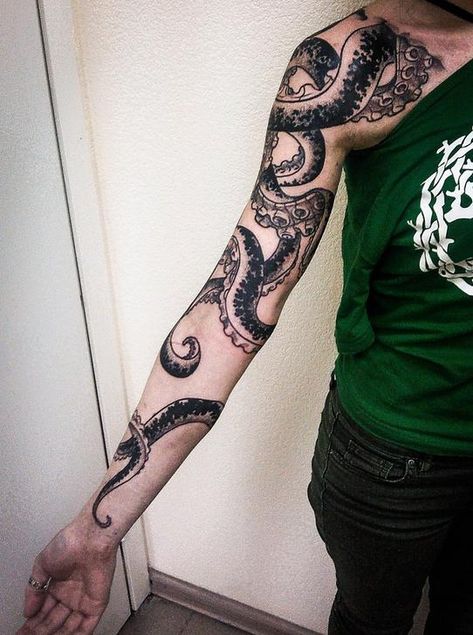 Black octopus tattoo on the right arm Wrap Around Arm Tattoo, Tentacle Tattoo, Octopus Tattoo Sleeve, Kraken Tattoo, Squid Tattoo, Around Arm Tattoo, Octopus Tattoo Design, Octopus Tattoos, Blackout Tattoo