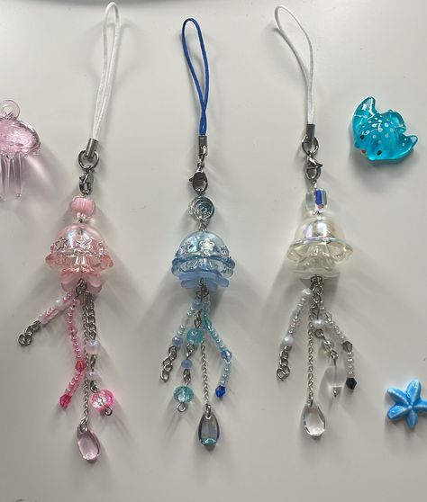 ˗ˏˋ ♡ ˎˊ˗ Matching jellyfish phone charm  ˗ˏˋ ♡ ˎˊ˗ ♡ ̆̈ Product details These phone straps are inspired by jellyfish with each one being different from the next. These cute little jellyfish have stars on the bell to make it. Each one is carefully handmade, ensuring a unique and personalized touch. ♡ ̆̈ Dimensions and specifications ◦ Length: 17cm ◦ Materials: phone strap with brass ends and iron ring  Please note that due to the handcrafted nature of each keychain, there may be slight minor visual differences. Additionally, the colours can vary from what you see on your screen due to monitor differences. We sincerely thank you for your understanding and really hope you enjoy this lovely addition to your daily life  If you have any questions at all, please don't hesitate to message me! ૮₍ Jellyfish Phone Charm, Phone Beads Strap, Diy Jewlry, Phone Beads, Diy Jellyfish, Cute Camera, Pretty Jewelry Necklaces, Phone Straps, Being Different