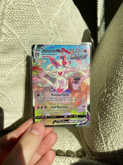 My FAVOURITE card i own so far! Its so beautiful 😍 whats your favourite card? #pokemon #sylveon #pokemoncards #eeveelutions #eevee #pink Pokemon Vmax Cards, Sylveon Pokemon Card, Custom Pokémon Cards, Pink Pokemon Cards, Aesthetic Pokemon Cards, Pokemon Card Aesthetic, Pokémon Card Art, Sylveon Aesthetic, Pokemon Cards Aesthetic