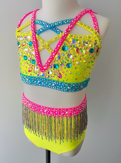 This stunning neon yellow jazz dance costume by Sparkle Worldwide is a bright and sassy colour combo that pops on stage. With beaded fringe and covered in bling, this piece is a #slay #dance #dancecostume #dancer #danceoutfit #neon #neoncostume #fahion #kidsfashion #dancemom Colorful Dance Costumes, Dance Costume Base, Neon Dance Costume, Pink Jazz Dance Costumes, Rhinestone Dance Costume Ideas, Yellow Dance Costume, Sassy Dance Costumes, Jazz Dance Costumes Sassy, Fringe Dance Costume