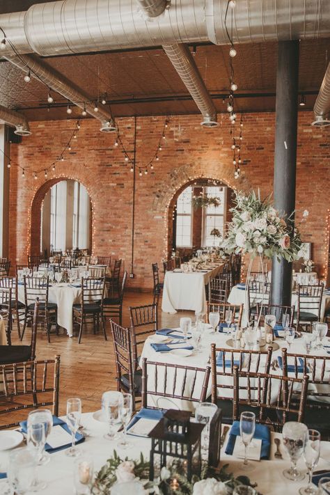 Our rustic romantic wedding venue was a dream. Exposed brick walls and brick arches, a tin ceiling, string lights and gorgeous wood chairs. The head table went through a rustic, romantic brick arch. Our reception was held in Buffalo, New York at Pearl Street, Pearl at the Webb. As a custom wedding invitation designer, I've seen it all and wanted something intimate and unique. For more wedding tips and tricks, visit my website below. #RusticWedding #RomanticWedding #Buffalowedding Wedding With Brick Walls, Brick Wedding Venues, Old Brick Wedding Venues, Wedding Decor Brick Wall, Brick Backdrop Wedding, Buffalo Wedding Venues, Brick Building Wedding Reception, Wedding Arch Brick Wall, Wedding Reception Brick Walls