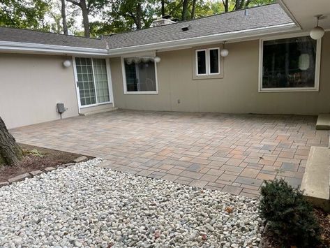 Stone paver patio with gravel walkway Paver Patio With Gravel, Paver Patio Ideas Layout, Stone Paver Patio, Pergola Fire Pit, Retaining Wall Construction, Gravel Walkway, How To Install Pavers, Outdoor Gathering Space, Wooded Area