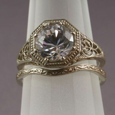 This ring is set with a CZ that is 8mm in size. The 8mm CZ would represent a 1.9ct diamond - the CZ is diamond cut so it sparkles much like a diamond. You could upgrade it later. They have collected thousands of antique molds and make ring mountings. Filigree Wedding Band, Engagement Rings Wedding Bands Set, Antique Filigree, Antique Engagement Ring, Antique Wedding Rings, Antique Engagement, Wedding Rings Vintage, Antique Engagement Rings, Vintage Engagement