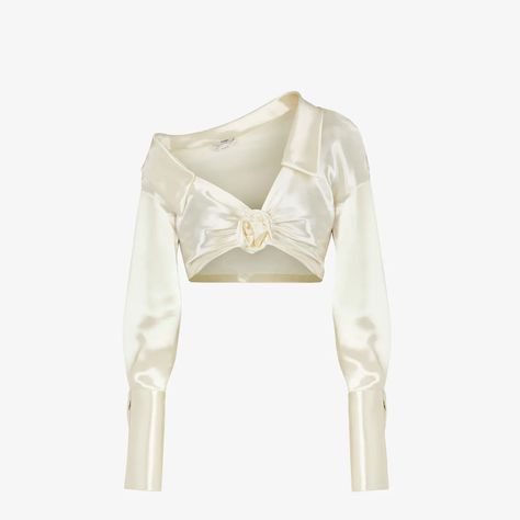 Cropped, V-neck, one-shoulder shirt with pointed collar. Made of cream shiny satin. The gathered motif on the chest is finished with a handmade silk rose. The sleeves are finished with wide cuffs and cufflink Fendi O’Lock buttons. White Satin Shirt, Fendi Shirt, One Shoulder Shirt, Color Crema, Silk Rose, Satin Shirt, Mode Inspo, Shoulder Shirts, Stage Outfits