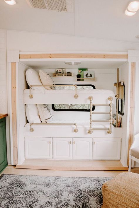 To maximize space, they added bunk beds to an area that was previously a slide-out entertainment center, and also included storage underneath. Photo 9 of 14 in Embark on Your Next Road Trip in This Renovated Camper For $35K Glamper Camper, Camper Trailer Remodel, Caravan Renovation, Built In Bunks, Cool Bunk Beds, Diy Camper Remodel, Rv Makeover, Rv Renovations, Camper Makeover