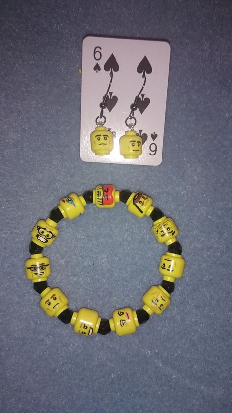 I had a bunch of broken Lego Minifigures, even though some were missing an arm and a leg it seemed a shame to throw them away so I decided to have a go at making an elasticated bracelet and matching pair of quirky matching earrings. Mf Doom Bracelet, Unhinged Bracelet Ideas, Lego Bracelet, Lego Diy Crafts, Lego Jewelry, Diy Kandi Bracelets, Lego Diy, Lego Craft, Diy Recycle