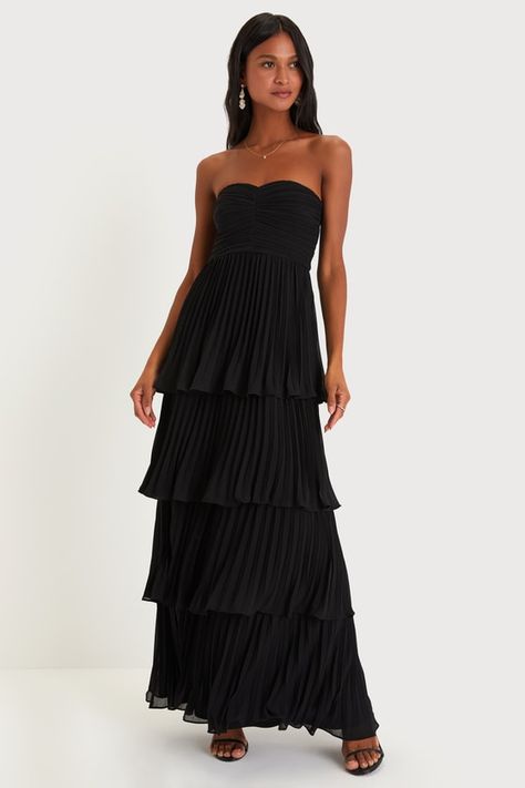 Sweeping everyone off their feet is so easy when you have a romantic look like the Lulus Seriously Sensational Black Strapless Tiered Maxi Dress! Lightweight pleated woven chiffon shapes this flirty dress that features a strapless bodice (with hidden no-slip strips) and a sweetheart neckline. The high, fitted waist tops a figure-skimming, tiered skirt that cascades down to a maxi hem. Hidden back zipper/clasp. Fit: This garment fits true to size. Length: Floor length. Size medium measures 52.5" Black Bridesmaids, Black Bridesmaid Dresses, Flirty Dresses, Midi Dress Casual, Tiered Maxi Dress, Hoco Dresses, Dress Purchase, Dance Dresses, Black Maxi Dress