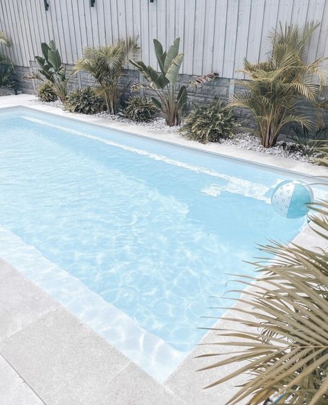 White Pools Outdoor, White Rocks Around Pool, Pool White Fence, White Concrete Pool Surround, White Fibreglass Pool, White Fiberglass Pool, White Pool Area, Coastal Pool Area, White Concrete Pool