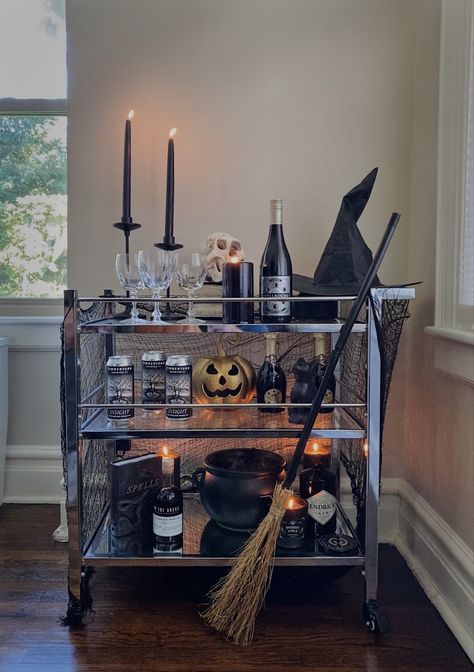 halloween bar carr witch decor Skeleton Pushing Bar Cart, Halloween Drink Cart, Halloween Bar Cart Ideas, Spooky Bar Cart, Halloween Bar Cart Decor, Halloween Island Decor, Witchy Dinner, Halloween Drink Station, Boo Brunch