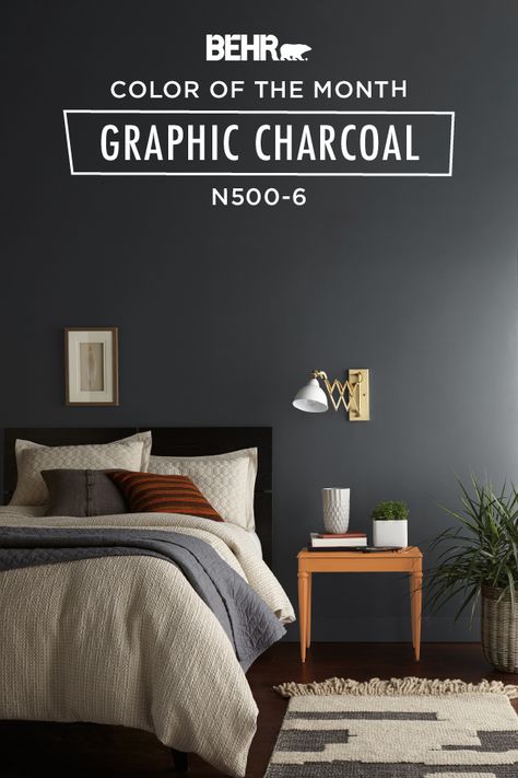 The Behr paint Color of the Month, Graphic Charcoal, is the perfect color for giving your bedroom a bold yet classic atmosphere. A dark and dramatic shade of gray, this wall color complements the neutral hues of the white bedspread, rug, and wood table. Click below to find more color inspiration. White Bedspreads, Color Of The Month, Behr Paint Colors, Bedroom Wall Paint, Bedroom Wall Colors, Nate Berkus, Bedroom Paint Colors, Bad Design, Bedroom Paint