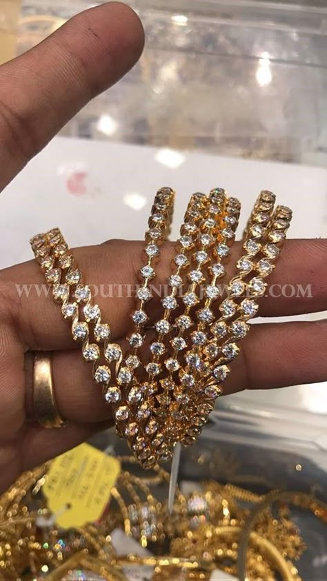 Beautiful 22k gold bangle studded with single row of white stones. Approximate weight is 80 grams. For inquiries please contact the seller below. Seller Name : Premraj Shantilal Jain Jewellers Address : POT MARKET Opp BATA Rp road,Hyderabad, India 500025. Contact No : 9700009000, 9951000005 Website : http://premshantijewels.blogspot.in/ Facebook : https://www.facebook.com/premrajshantilaljainjewellers/ Related Posts50 Grams Gold … White Stone Bangles Gold, Single Bangle Designs Gold, Stone Bangles Gold, White Stone Bangles, Premraj Shantilal Jain Jewellers, 22k Gold Bangles, Stone Bangles, Diamond Bracelet Design, Gold Bangle Set