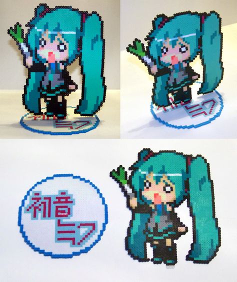 Perler Bead Hachune Miku with Stand by NerdyNoodleLabs on DeviantArt Sakura Miku Pixel Art, Hatsune Miku Perler Beads Pattern, Japanese Perler Beads, Chibi Perler Beads, Pixel Perler Beads, Miku Perler Bead Patterns, Love Perler Bead Patterns, Hatsune Miku Perler Beads, Vocaloid Perler Beads