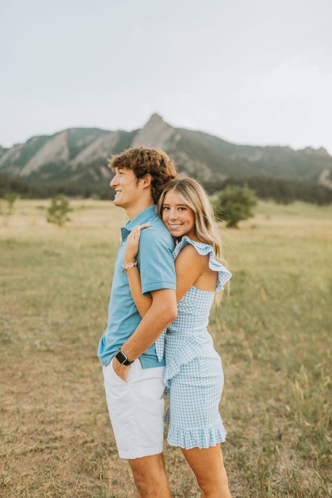 Colorado Engagement Photographer | Hannah Basler Photo / couples photographer / candid couples photos / poses / engagement poses / engagement photo outfits / poses for pictures instagram / senior photos / girl senior photos / colorado senior photos / blue dress / summer outfit / summer trendy / nature / urban outfitters / summer hair / tiffany / canon / canon 5d mark iv / jeans outfit / casual senior photos / jeans casual outfit / blue tshirt outfit / canon m50 mark ii Couple Poses In Jeans Top, Jeans And Tshirt Engagement Photos, Jeans Beach Photoshoot Couple, White Tee And Jeans Engagement Photos, Engagement Photos Blue Jeans White Shirt, Couple Beach Pictures Jeans, Blue Tshirt Outfit, Urban Outfitters Summer, Engagement Announcement Photos