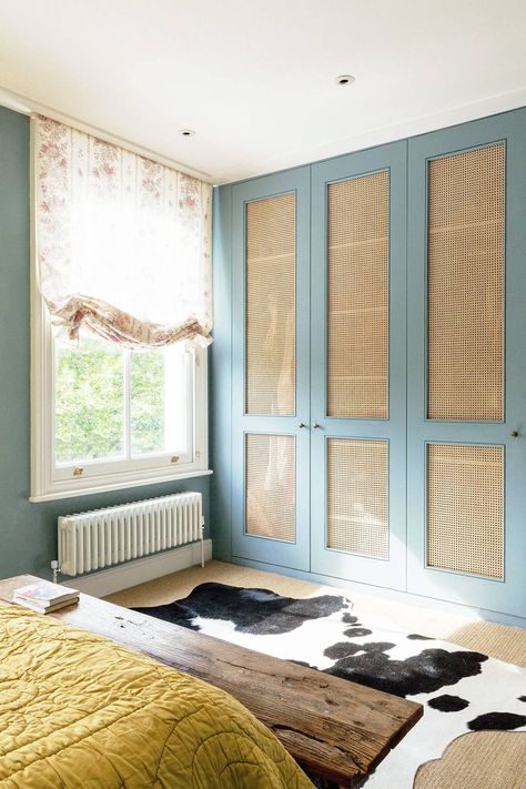 [i]In the spare bedroom, Matilda removed the panels from the built-in wardrobe doors and stapled cane to the back of them[/i] Built In Wardrobe Doors, British Decor, Ceiling Storage, Farmhouse Side Table, Wicker Decor, Bedroom Wardrobe, In The Corner, Spare Bedroom, Wardrobe Doors