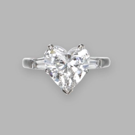 "Platinum and Diamond Ring, Graff The heart-shaped diamond weighing 3.07 carats, flanked by tapered baguette diamonds, size 6, signed Graff." © Sotheby's (quote) via sothebys.com Heart Cut Diamond Ring, Carrie Underwood Hair, Heart Shaped Engagement Rings, International Jewelry, Baguette Diamonds, Heart Diamond, Heart Shaped Diamond, Gemstone Jewellery, Carrie Underwood