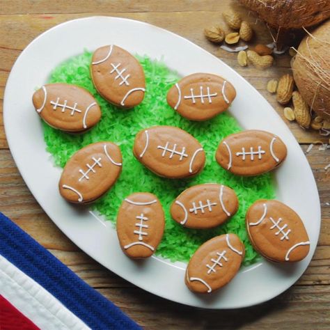 Football Macarons Recipe by Tasty Football Macarons, How To Make Macarons, Orange Food Coloring, Yellow Foods, Ground Almonds, Macaron Recipe, Green Food Coloring, Gel Food Coloring, Creamy Peanut Butter