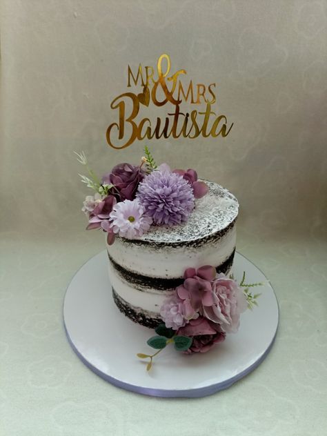 It's a chocolate moist cake with caramel filling and whipped cream frosting Cake With Artificial Flowers, Chocolate Moist Cake, Flower Cake Design, Purple Cake, Purple Cakes, Moist Cake, Cake Designs Birthday