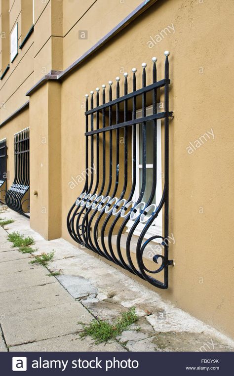 Download this stock image: Wrought iron window bars on the exterior of an urban building at street level - FBCY9K from Alamy's library of millions of high resolution stock photos, illustrations and vectors. Iron For Windows, Window Tattoo Design, Wrought Iron Window Grill, Window Seating Ideas, Window Tattoo, Wrought Iron Window, Iron Window Grill, Modern Window Grill, Window Seating