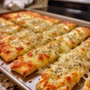 Cheesy Garlic Breadsticks, Garlic Cheese Breadsticks, Cheesy Garlic Bread Sticks, Pizza Dough Garlic Breadsticks, Cheesy Garlic Breadsticks With Pizza Dough, Garlic Twist, Appetizer Wraps, Cheesy Bread Recipe, Cheese Bread Sticks