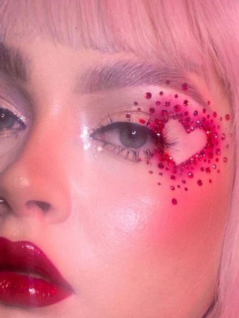 heart-shaped red gems eye makeup look Heart Makeup, Concert Makeup, Rhinestone Makeup, Heart Eye, Day Makeup Looks, Cute Eye Makeup, Graphic Makeup, Rave Makeup, Valentines Day Makeup