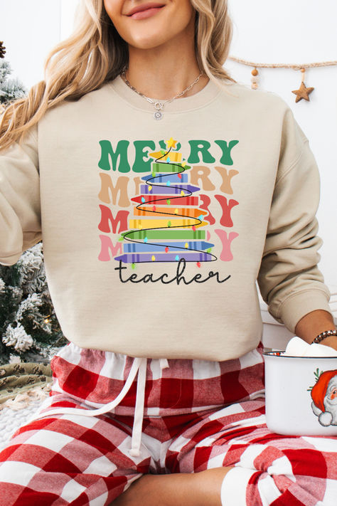 Be merry and bright this school year with these fun holiday teacher sweatshirts.  If you want to spread Christmas cheer to the students and feel festive then you'll need to snag one of these sweaters.  These also make a great teacher gift for Christmas or for a teacher appreciation gift. Teacher Sweatshirt Ideas, Christmas Shirts Ideas, Teacher Christmas Shirts, Sweatshirt Ideas, Teacher Sweatshirt, Shirts Ideas, Great Teacher Gifts, Be Merry, Teacher Appreciation Gift