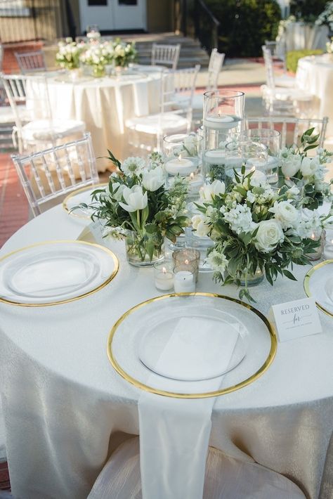 Anoosha and Kevin's color scheme for their wedding day were white, green and gold. | Photo: Naheeda Spencer Photography #weddingsinhouston #realwedding #houstonwedding #weddinginspo #weddingideas #receptiondecor #weddingreception #gardenwedding #outdoorweddingreception #weddingphotography #Indianweddings #floralcenterpieces #summerwedding Gold White Green Wedding Place Settings, Green And Gold Wedding Reception, Wedding Table Settings Round, Green White Gold Wedding, White Green And Gold Wedding, Green White And Gold Wedding, Gold Wedding Decorations Receptions, Green And Gold Wedding, Green Gold Weddings