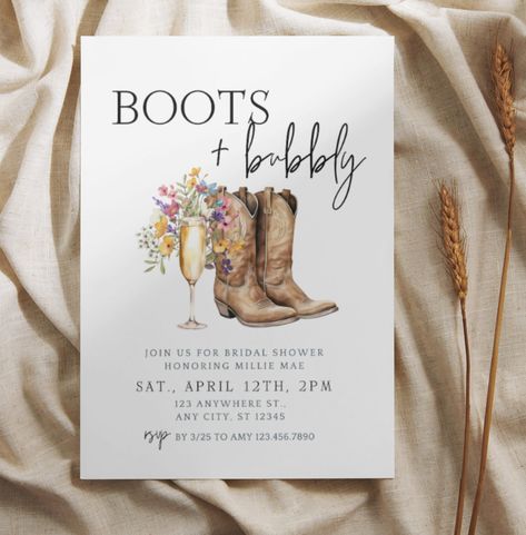 This gorgeous boots and bubbly Bridal Shower Invitation themed bridal shower invitation is a fully editable design. Personalize your template in Canva, a free & easy-to-use template editor that works in your web browser. Easily edit the background color, text, and fonts. FEATURES: Gorgeous script font, watercolor boots and champagne flutes, wildflowers WHAT'S INCLUDED * Invitation Template 5 x 7" *Video Walkthroughs on using Canva *Canva Guide *Print Guide Additional template sizing is possible Bridal Shower Boots And Bubbly, Boots And Bubbles Bridal Shower Ideas, Bridal Shower Party Themes, Boots And Bubbly Bridal Shower Decor, Country Bridal Shower Themes, Boots And Bubbly Bridal Shower Ideas, Country Bridal Shower Ideas, Boots And Bubbly Bridal Shower, Boots And Bubbly