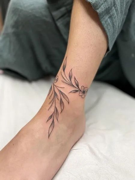 Ankle To Foot Tattoos For Women, Wrist Floral Tattoo, Ankle Floral Tattoo, Black And White Floral Tattoo, White Floral Tattoo, Ear Floral Tattoo, Watercolor Floral Tattoo, Vine Foot Tattoos, Wrap Around Ankle Tattoos