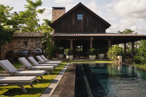 Tour a Century-Old Pennsylvania Barn House That Was Reassembled in the Dominican Republic | Architectural Digest Barn Pool House, Jeffrey Dungan, Barn Pool, Colonial Exterior, Party Barn, Country Retreat, Beautiful Outdoor Spaces, Modern Barn, River House