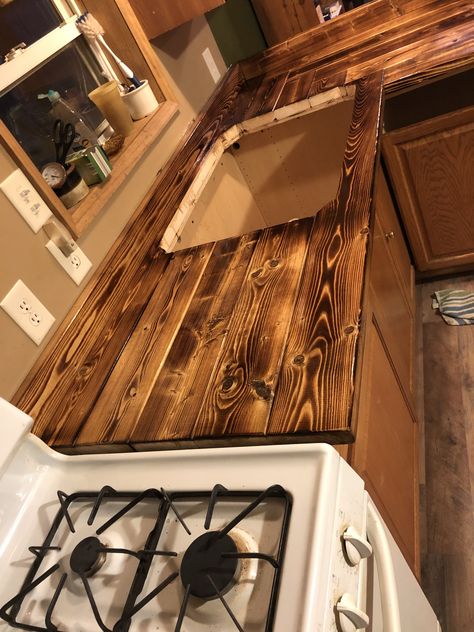 Pallet Wood Countertops Kitchen, Pallet Wood Countertop, Rustic Countertops Kitchen Counters, Burnt Wood Countertops Kitchen, Diy Cabin Kitchen, Pallet Countertop Kitchen, Rustic House Remodeling Ideas, Burnt Wood Countertops, 2x4 Counter Tops