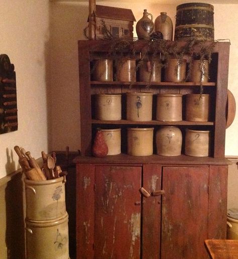 Primitive cabinet filled with crocks Crock Collections, Decorating With Crocks, Primitive Crocks, Primitive Cabinet, Rustic Shelving, Primitive Interiors, Primitive Cabinets, Primitive Cupboards, Antique Crocks