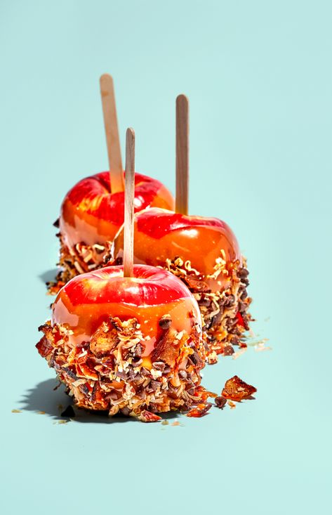 Editorial food photography featuring caramel dipped apples with coconut and bacon crust. Shot for Moinked Magazine. © Copyright Suzanne Clements. All Rights Reserved. #caramel #apple #Fall #food #sweet #treat #onastick #caramelapple #dessert #bacon Caramel Apples Aesthetic, Caramel Apple Photography, Apples Food Photography, Candy Apple, Apple Cake Photography Food Styling, Autumn Apples Photography, Colour Pop, Apples Photography, Caramel Dip