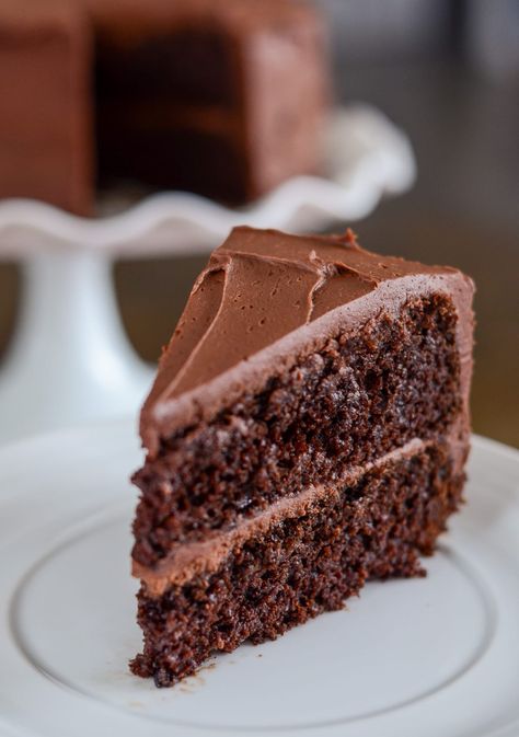 Delicious Two Layer Chocolate Cake with homemade chocolate frosting. This cake is simple, perfectly moist and the homemade chocolate frosting is divine! Chocolate Cake No Buttermilk, Simple Chocolate Cake Recipe, Easy Moist Chocolate Cake, Perfect Cake Recipe, Simple Chocolate Cake, Chocolate Cake From Scratch, Homemade Buttercream, Homemade Buttercream Frosting, Chocolate Cake Recipe Moist