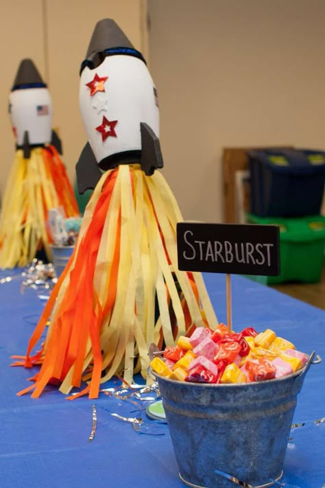 Outer Space Theme Centerpieces, Diy Rocket Ship Cardboard Space Party, Space Ranger Birthday Party, Space Party Diy Decor, Rocket Ship Centerpiece Space Theme, Outer Space Birthday Centerpieces, Rocket Ship 3rd Birthday Party, Galaxy Theme Centerpiece Ideas, Rocket Centerpiece Space Party