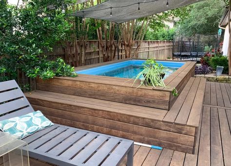 A pool built semi-above ground on a deck with a lounge chair sitting beside it. Semi Above Ground Pool, Backyard Pool Ideas, Pool Ideas On A Budget, Endless Pool, Cheap Backyard, Small Balcony Design, Mini Pool, Big Backyard, Above Ground Pool Decks