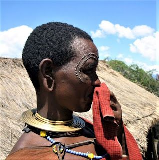 Maasai and other traditional African tattoo designs are becoming more popular as tattoo choices for people around the world for retaining cultural heritage.Both Maasai and modern-day tattoos are created by puncturing the skin with a needle and injecting ink or pigment into the punctured area. The designs and motifs used in modern-day tattoos may differ from those used in Maasai tattoos, but the basic technique and process of tattooing is the same.Tattooing has a long history in various African c Norms And Values, African Tattoo, Facial Piercings, Social Status, Cultural Identity, Spiritual Protection, Long History, Maasai, Body Modifications