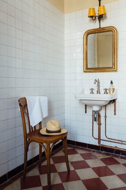 French Country Bathroom in bathroom ideas, white tiled bathroom with checkerboard tiled floor, traditional sink and fittings, antique gold vanity mirror. Traditional Sink, Tiled Bathroom, Gold Vanity, Homes In France, French Country Bathroom, Checkerboard Floor, Tiled Floor, White Bathroom Tiles, French Country Bedrooms