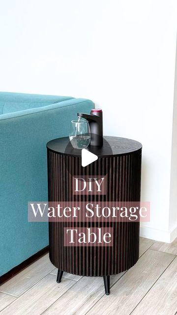 Andreja Juknevicius on Instagram: "Definitely an upgrade 👌🏻 Comment DIY and I'll send you the link directly! Or find everything you need for this DIY table under ✨ Home Finds ✨ on my website 👉🏻 LINK IN BIO (andrejaelena.com) 🤍 . . How convenient and beautiful is this dispensing table with built in storage for your water jug?! 😍 If you would like to make one too, everything you need is linked on my website under Home Finds and the directions are here 👇🏻 I also have one that uses a different table that is white. . DIY Instructions: 1) Use the 2 1/4" hole saw (with a drill) to cut a hole at the top of the table 2) Place the 1" pan upside down at the bottom for additional height 3) Place the water dispenser on top (please note: the water dispenser will not sit firmly on top of the tabl Diy Water Table, Diy Storage Table, Aesthetic Storage, Dispenser Diy, 5 Gallon Water Bottle, Water Bottle Storage, Storage Table, Water Table, Diy Water