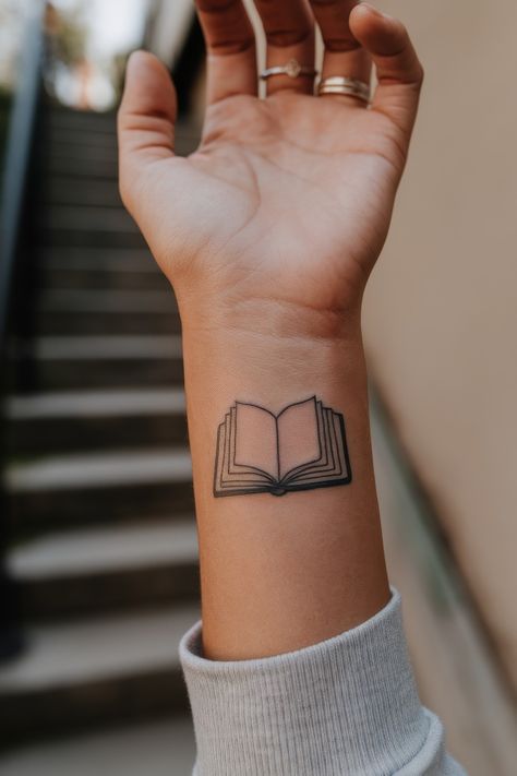 75 Book-Inspired Tattoos Perfect for Bookworms 🌿 Writers Tattoos Ideas, Magical Book Tattoo, Tattoo Ideas For Book Lovers, Book Tattoo Simple, Bookworm Tattoo Ideas, Bookish Tattoos Book Lovers, Book Lover Tattoos, Book Related Tattoos, Book Lover Tattoo Ideas