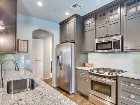 Small galley kitchen with gray cabinets, andino white granite and light blue subway tile backsplash Grey Galley Kitchen, Small Gallery Kitchen, Gallery Kitchen Layout, Kitchen With Gray Cabinets, Gallery Kitchen Ideas, Small Galley Kitchen Designs, Open Galley Kitchen, Galley Kitchen Renovation, Small Galley Kitchen