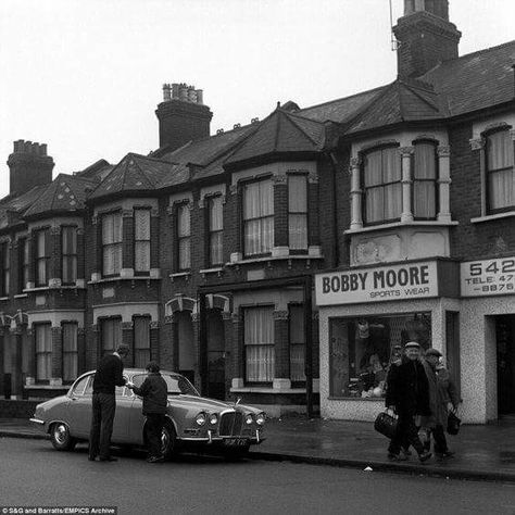 Bobby Moore's sports shop in green street upton park . The England captain can be seen signing an autograph beside his Jag. 1958 World Cup, Brian Clough, Bobby Moore, London Streets, Hampden Park, West Ham United Fc, East End London, Beatles Music, Nostalgic Pictures